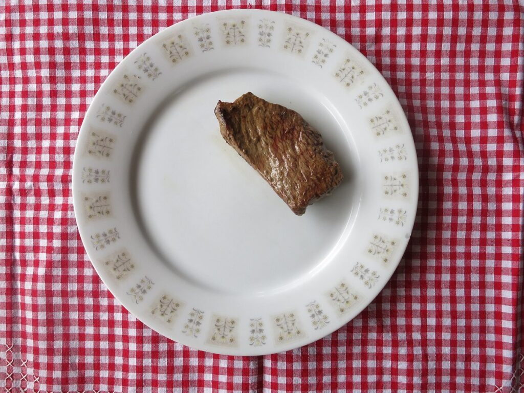 65 grams red meat (100 grams raw weight)